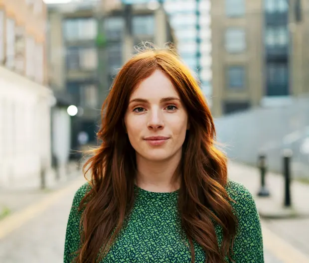 Woman with red hair on street