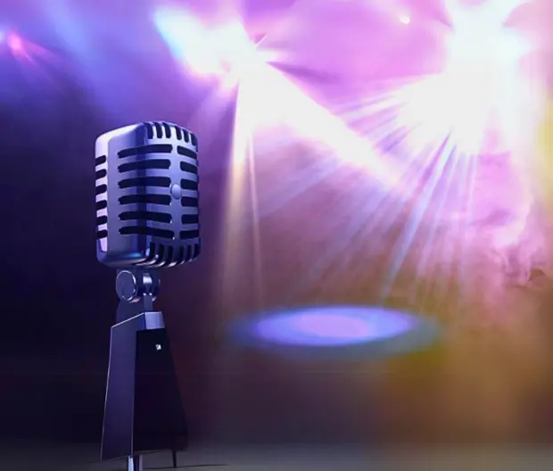 a microphone on a stage with lights