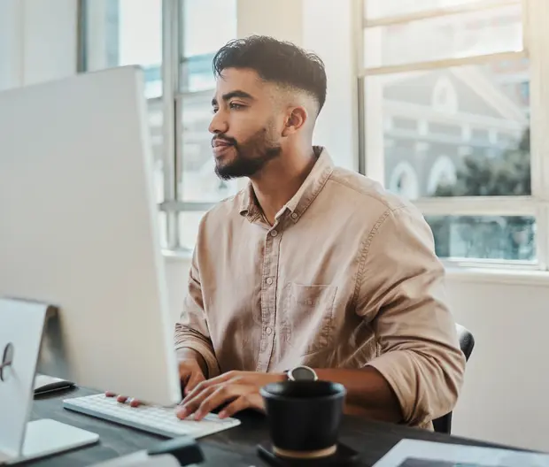 Young man sitting at his computer