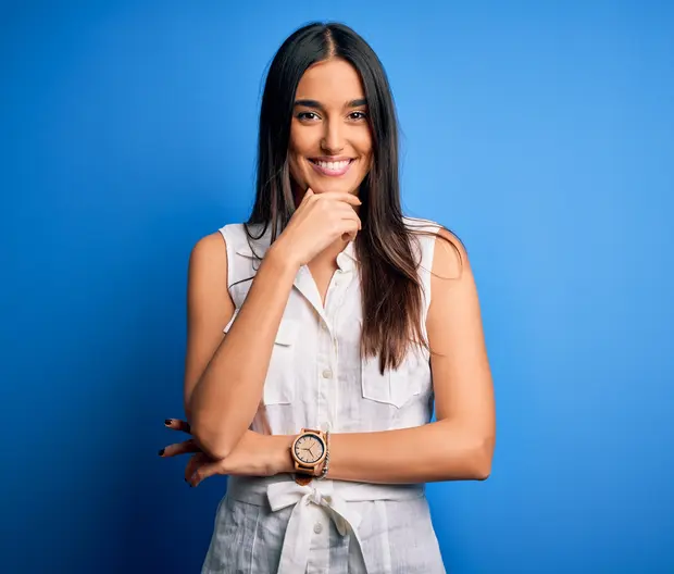woman smiling, blue background