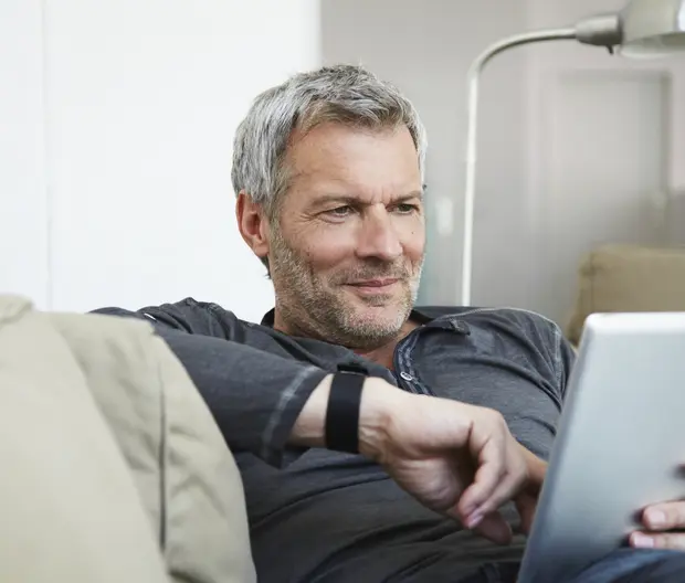 Portrait of man sitting on couch 