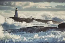 Lighthouse surrounded by surf