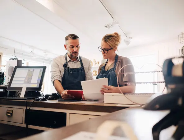 Two people working at a countertop