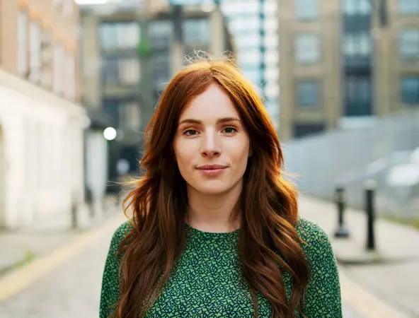 Woman with red hair on street