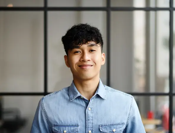 Man in front of window