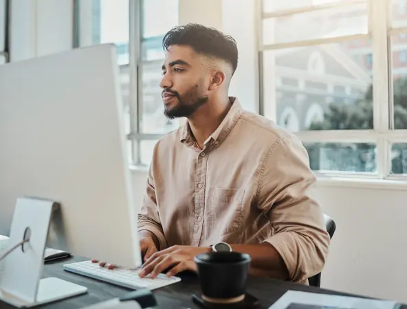 Young man sitting at his computer