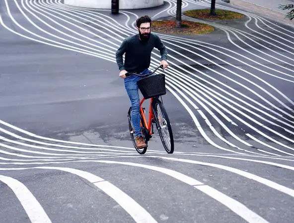 A man riding a bike in many tracks 