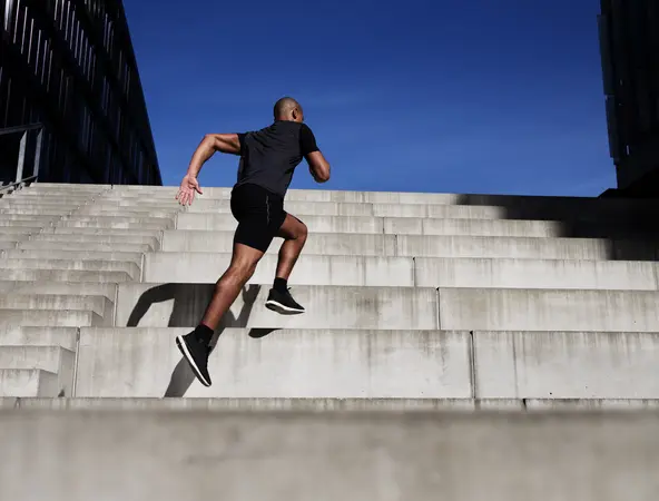 man running up stairs