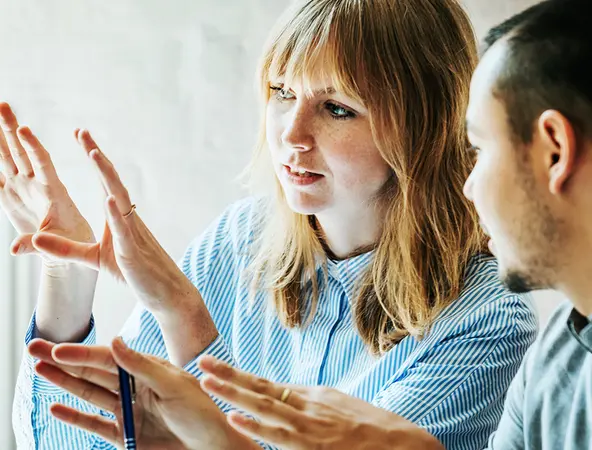 woman demonstrating something on the monitor