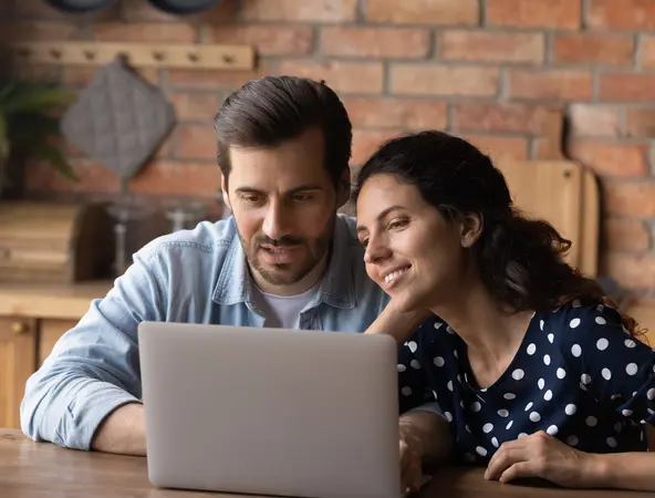 a couple look a the computer