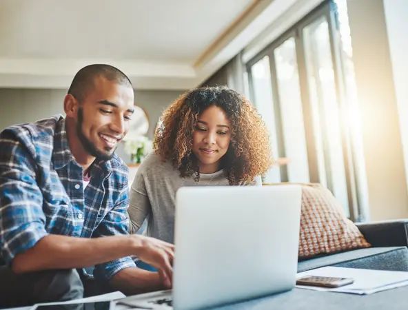 couple on their laptop talking about finance