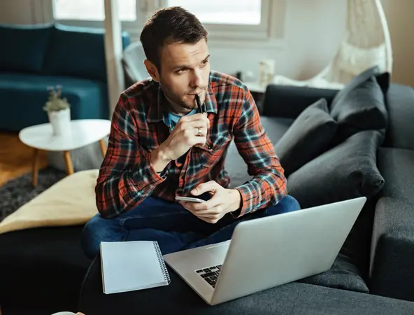 man thinking at his desk