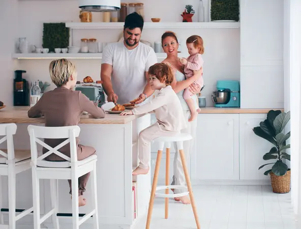 family with 3 children cooking in the kitchen