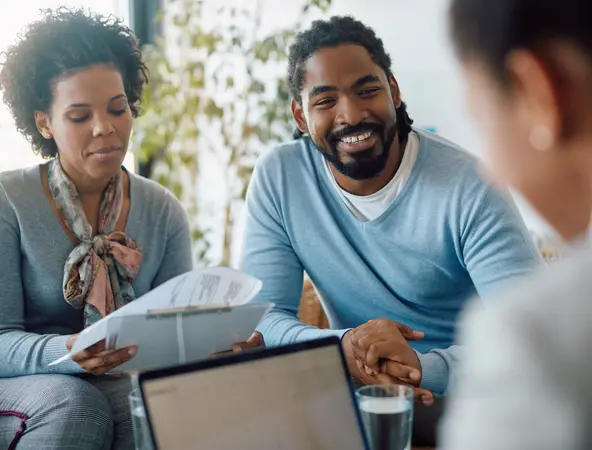 couple talking with their financial advisor