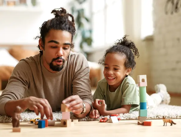 father and daughter playing