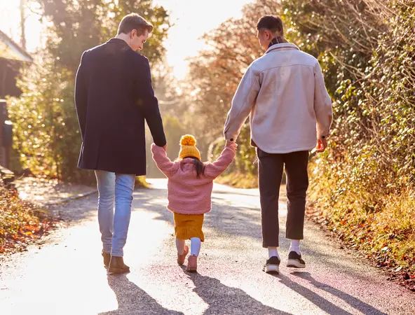 couple walking with their kid