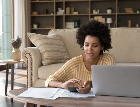 woman calculating her expenses and savings