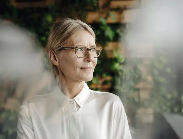 woman in her 50s looking away