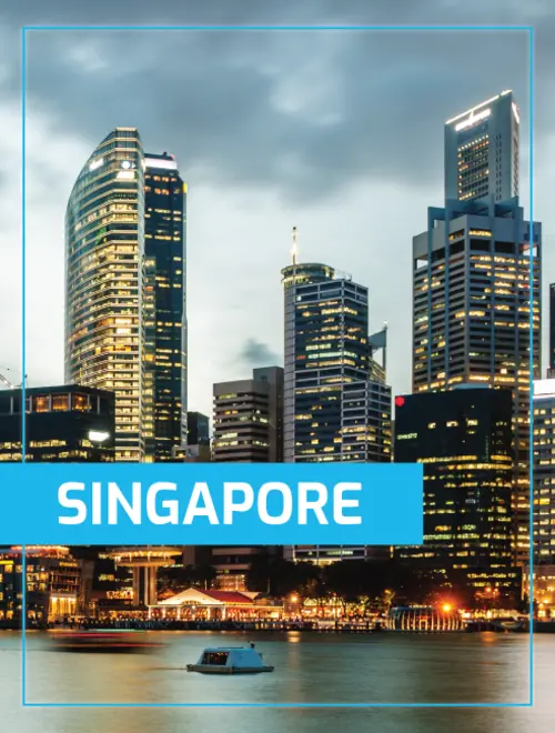 City skyline of Singapore at dusk, showcasing modern financial buildings near the water.