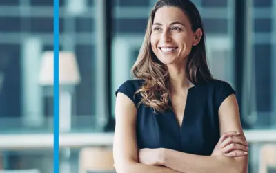 An asset manager in the Amundi offices, confidently posed with arms crossed.