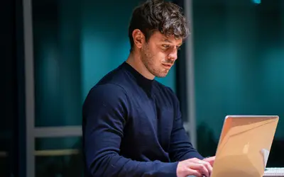 A man checking his laptop