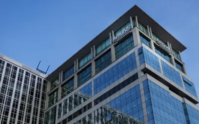 Modern glass office building representing Amundi's asset management presence.