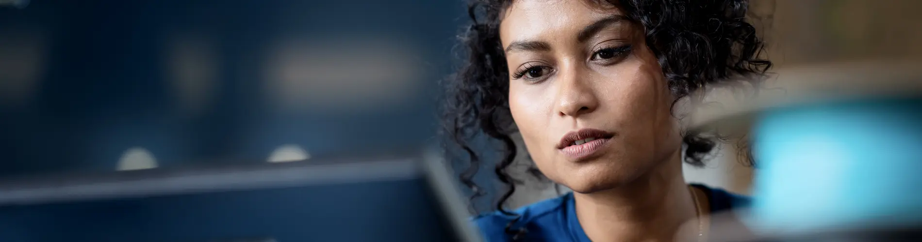 Woman checking her phone at the office