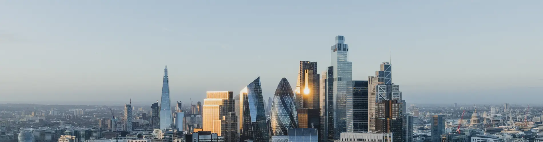 Skyline view of London, showcasing financial district buildings and investment opportunities.