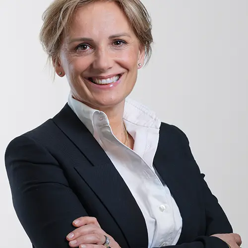 An asset manager in a suit poses confidently in the Amundi offices.