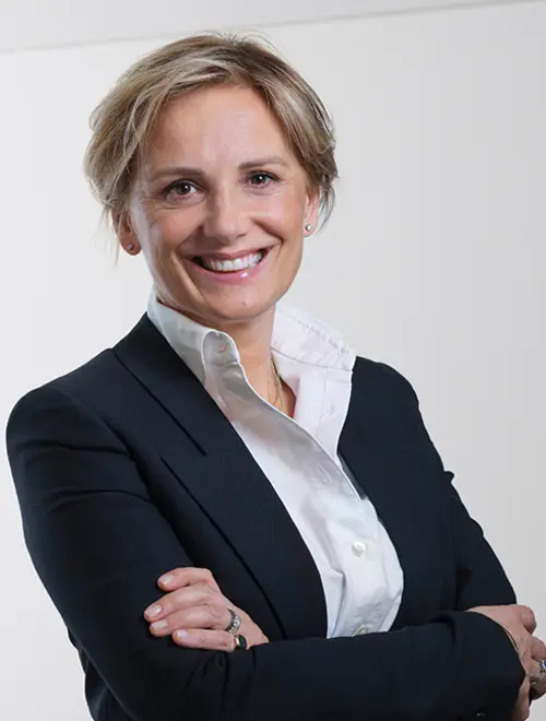 An asset manager in a suit poses confidently in the Amundi offices.