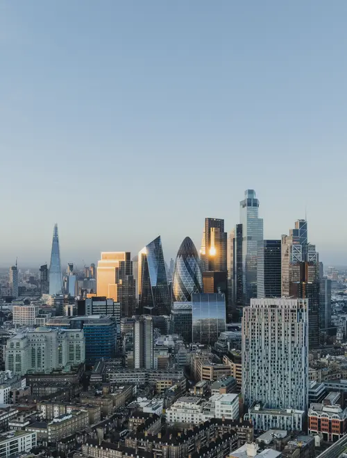 Skyline view of London, showcasing financial district buildings and investment opportunities.