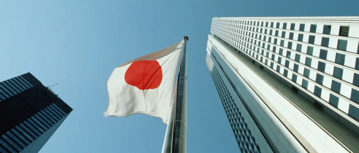Japan Flag and Buildings from below 