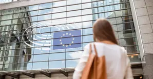 Businesswoman standing back near the Parliament building of European Union in Brussel city