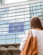 Businesswoman standing back near the Parliament building of European Union in Brussel city